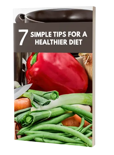 The image is a book cover featuring a variety of fresh vegetables, including a red bell pepper, green beans, and carrots, with a dark pot partially visible in the background. The title at the top reads "7 Simple Tips for a Healthier Diet" in white bold text on a dark rectangular background.