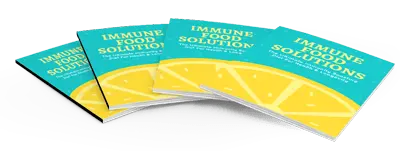Four copies of a booklet titled "Immune Food Solutions" are fanned out. The cover is blue and yellow with a design resembling lemon slices.